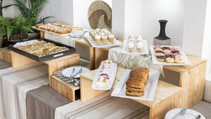 A buffet with various pastries, desserts, and beverages. - Hotel Gran Palace (Santiago)