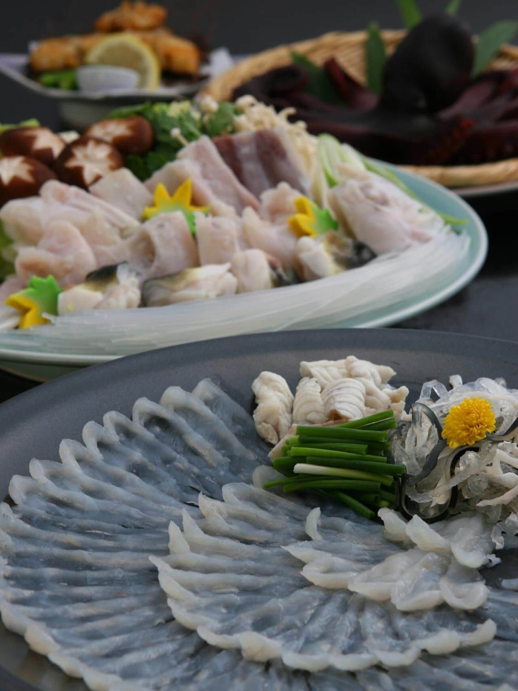 A variety of dishes on a table, including seafood and vegetables.