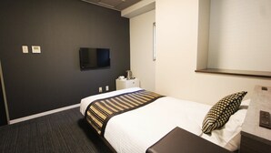 A hotel room with a bed, a nightstand, a television, and a window. - Hotel AreaOne NOBEOKA (Nobeoka)