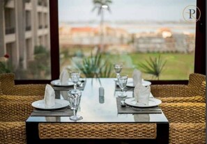 Breakfast, lunch served; local and international cuisine, pool views - Panacea Suites Hotel (Borg el Arab)