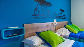 Family Room | Desk, blackout drapes, free WiFi, bed sheets