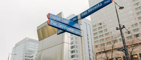 A street sign with directions to various locations.