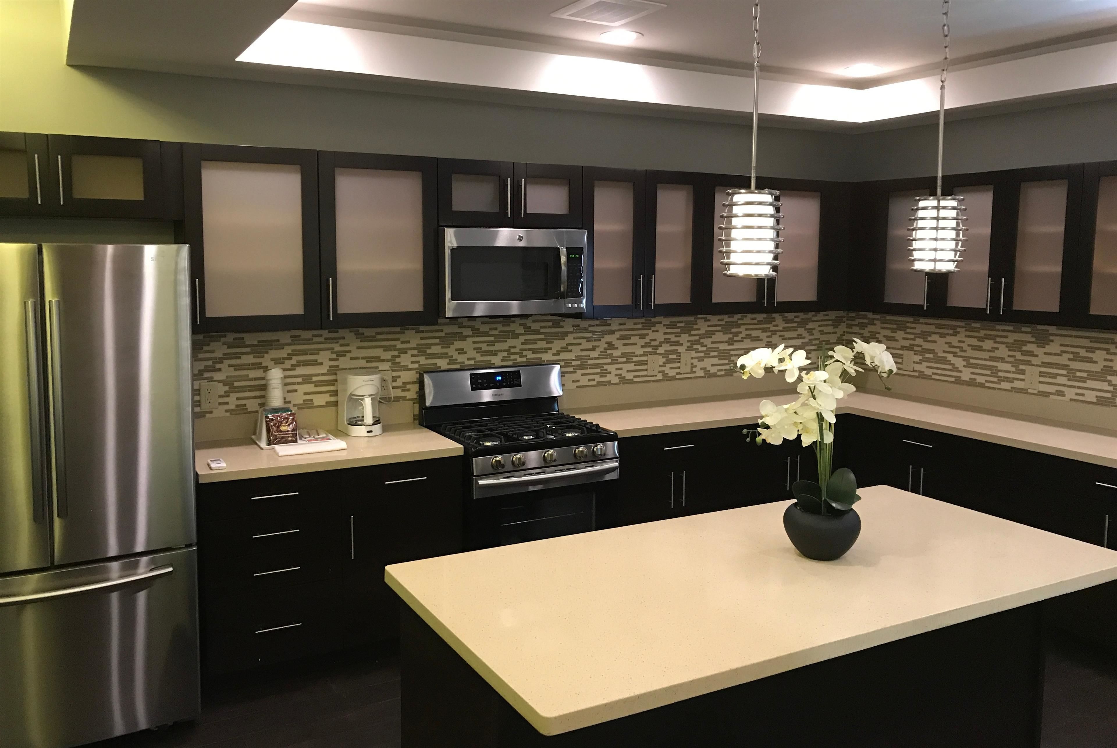 suite, non smoking (three bedroom) | private kitchen | full-sized fridge, microwave, stovetop, dishwasher