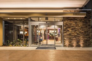 A hotel entrance with a stone facade, glass doors, and a number '501' above. - Fairfield Inn & Suites by Marriott Florence I-20 (Florence)