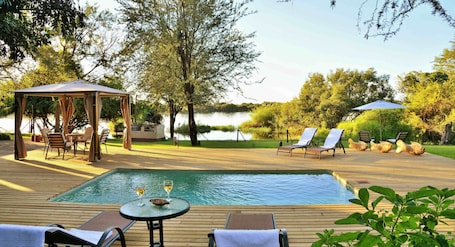 Outdoor pool, pool umbrellas, sun loungers