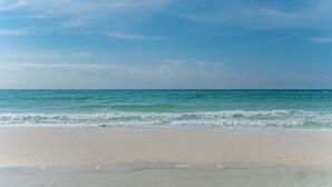 A beach with clear skies and calm waves. - Destin West Resort by Panhandle Getaways (Fort Walton Beach)
