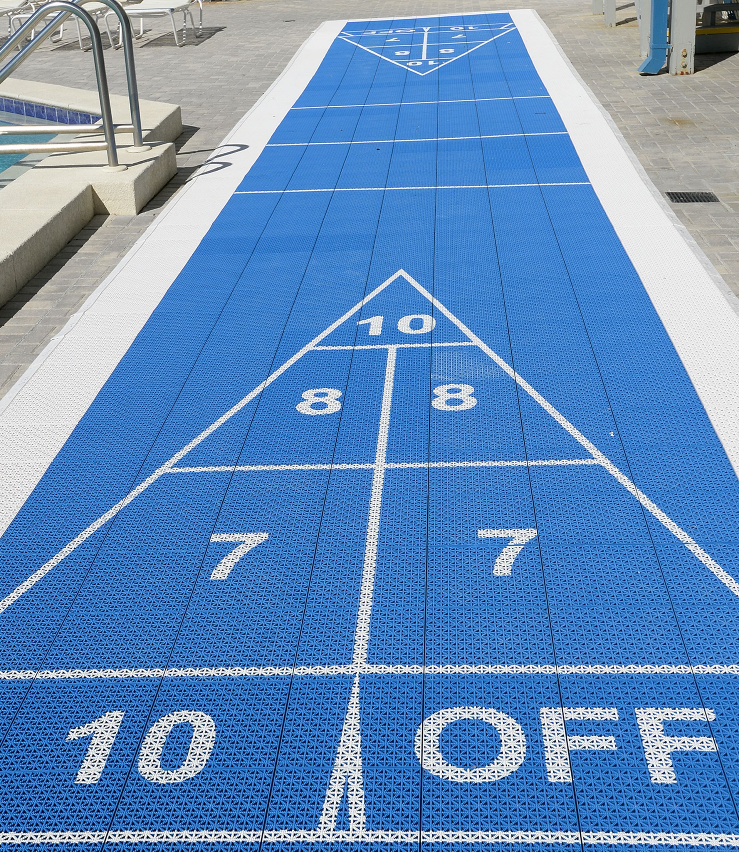 A shuffleboard court with numbered scoring areas and a '10 OFF' zone.
