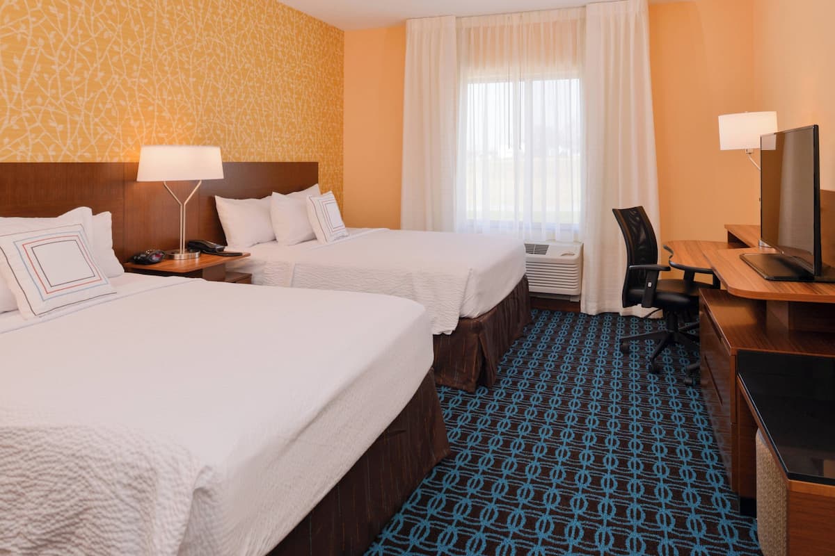 Pillowtop beds, desk, blackout drapes, iron/ironing board