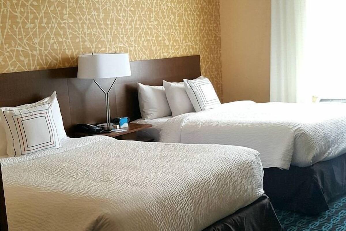 Pillowtop beds, desk, blackout drapes, iron/ironing board