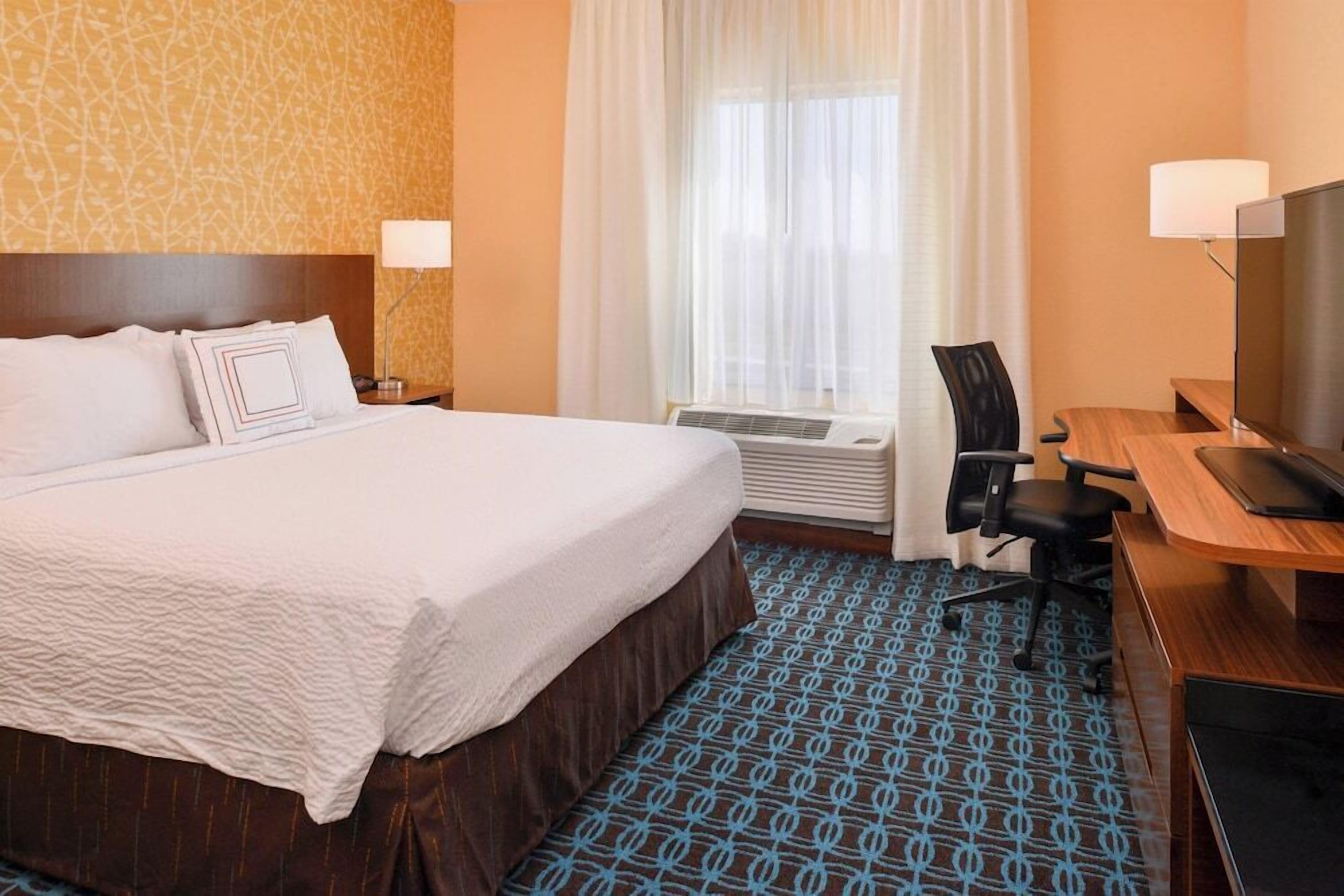Pillowtop beds, desk, blackout drapes, iron/ironing board