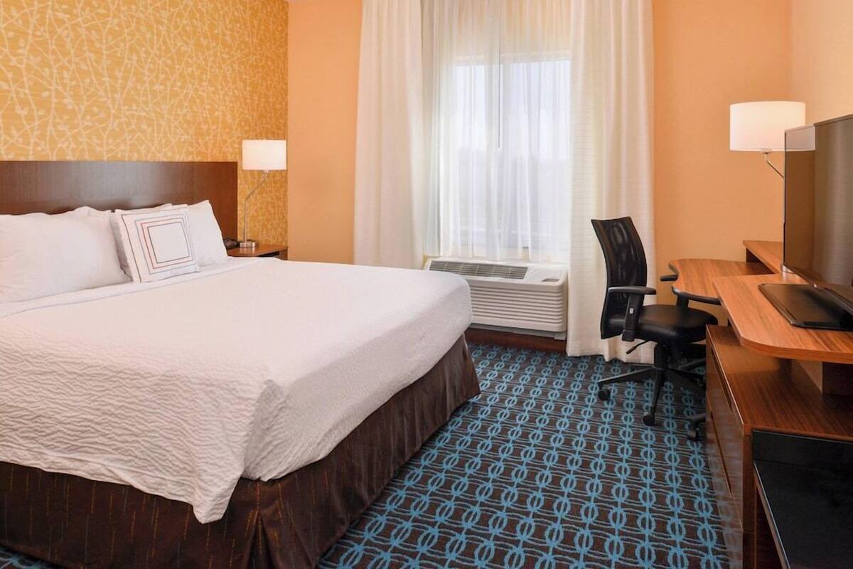 Pillowtop beds, desk, blackout drapes, iron/ironing board