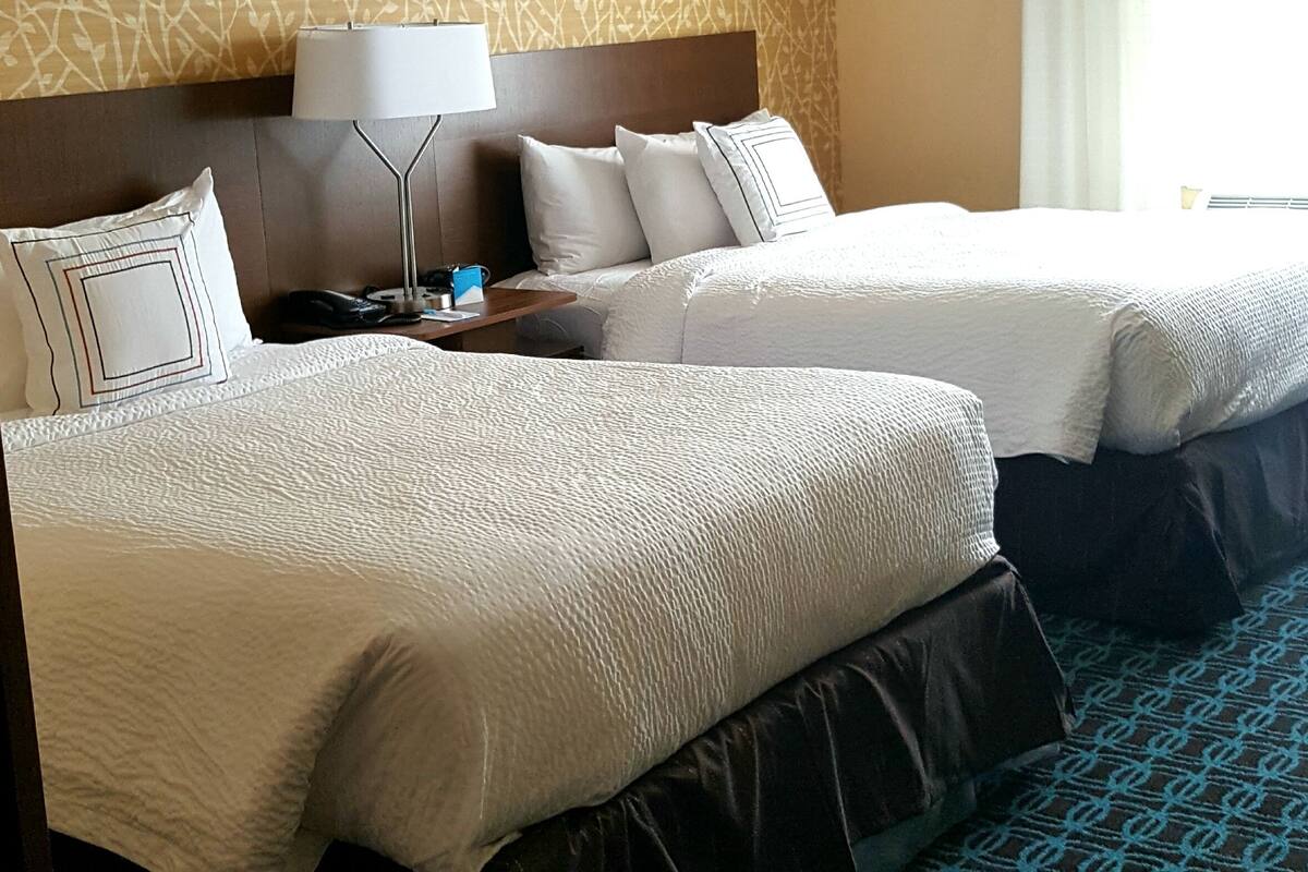 pillow-top beds, desk, blackout curtains, iron/ironing board