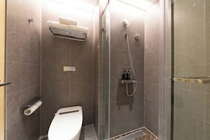 A modern bathroom with a glass-enclosed shower, a toilet, and a towel rack. - East Sacred Hotel-near Beijing Tiananmen Square,the Forbidden City,Wangfujing Street-Newly renovated hotel (Beijing)