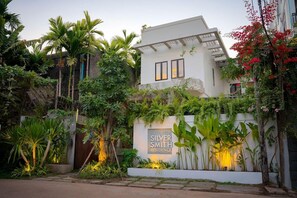 A modern residential building with a white facade, two visible windows, and a sign indicating 'Silver Smith Residence.' - Bopha Residence (Siem Reap)