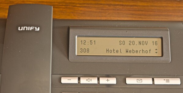 A UNIFY device with a display showing the time as 12:51, date 20.NOV 16, and room number 308 at Hotel Weberhof. - Hotel Weberhof (Zittau)