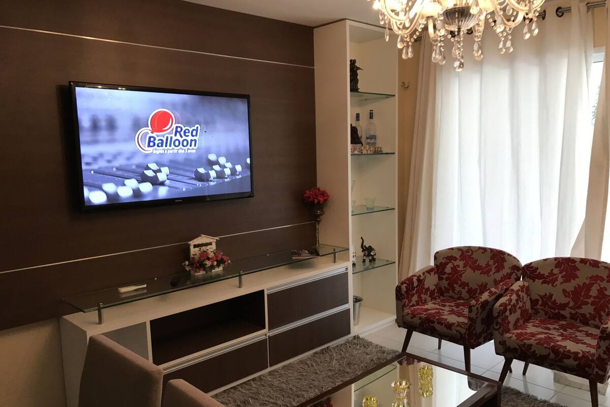 Deluxe Apartment | Living room | Flat-screen TV