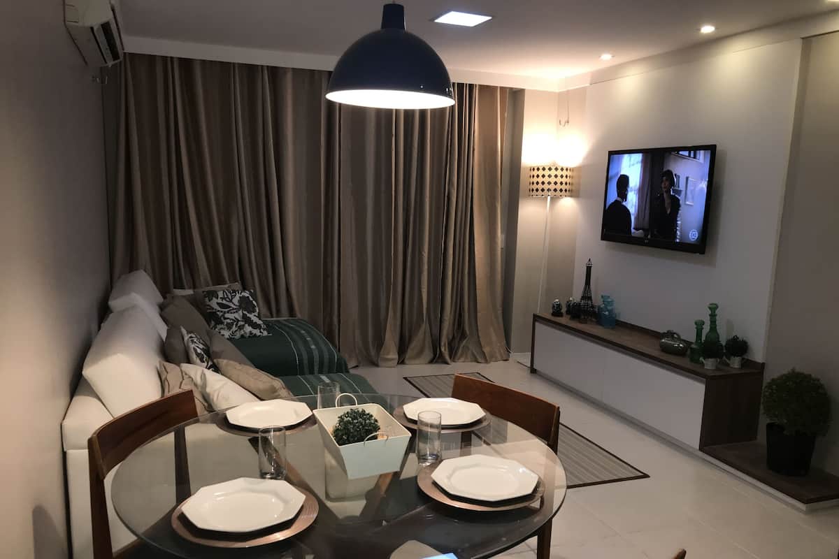 Deluxe Apartment | Living room | Flat-screen TV