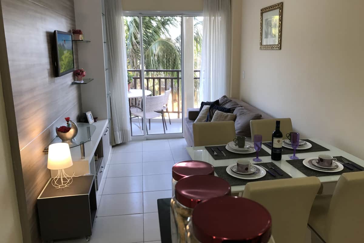 Deluxe Apartment | Living room | Flat-screen TV