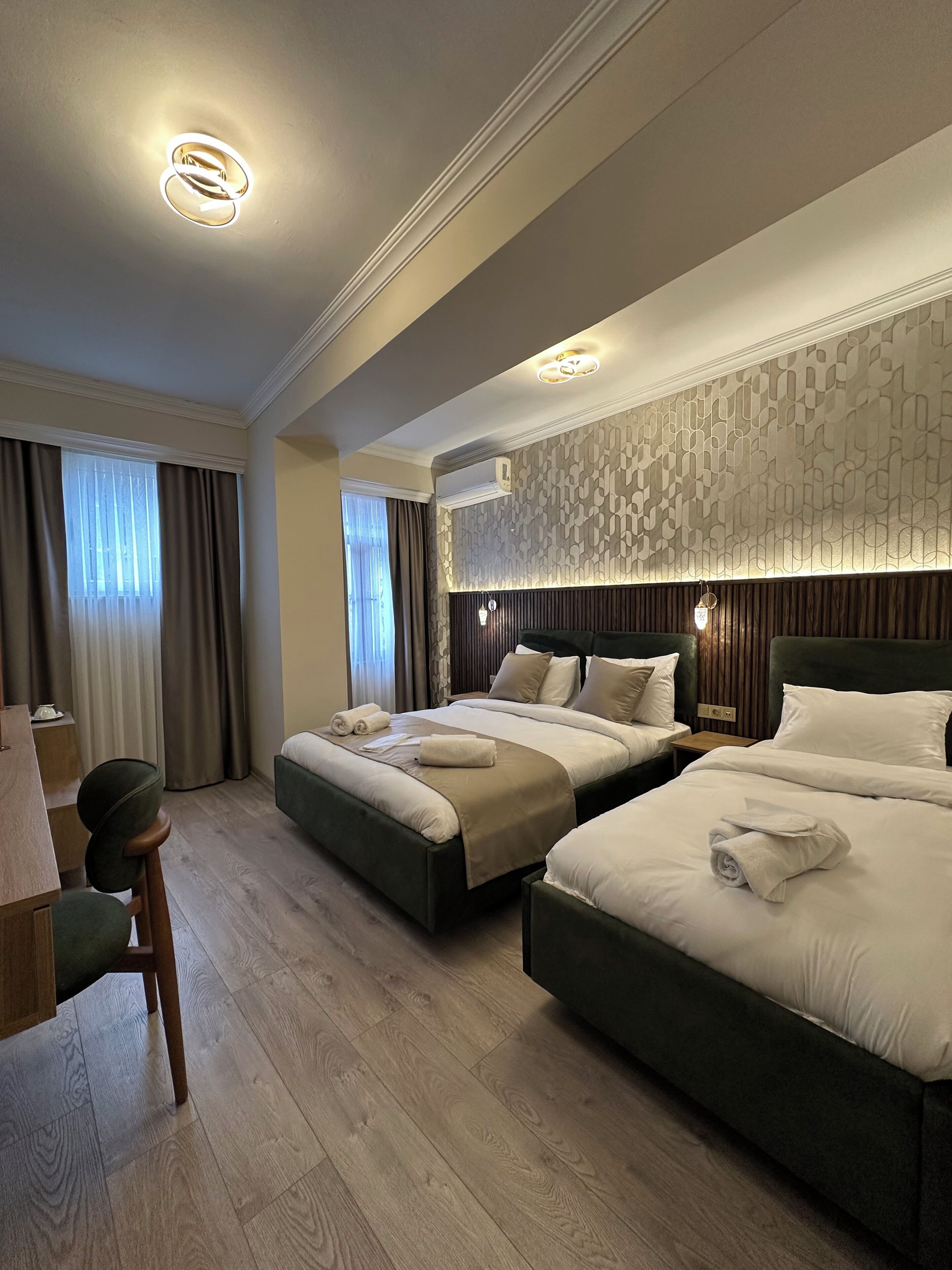 Economy Triple Room | Premium bedding, minibar, in-room safe, desk
