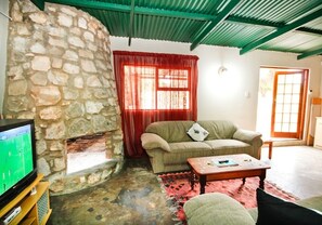 Skoolhuys | Living room | TV - BOTTERKLOOF RESORT (Still Bay)