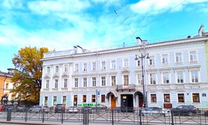 Stunning classical building with a symmetrical facade and decorative roofline.
