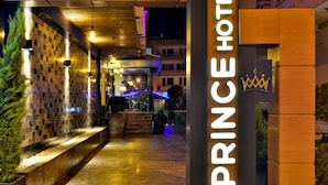 A modern hotel entrance with a prominent sign reading "PRINCE HOTEL" and a crown logo. - Prince Apart Hotel (Alanya)