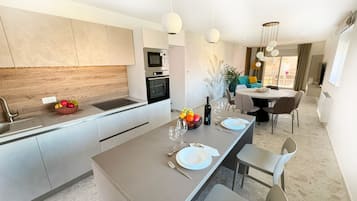 Superior Apartment, 2 Bedrooms, Balcony, Sea View | Private kitchen | Fridge, electric kettle, cleaning supplies