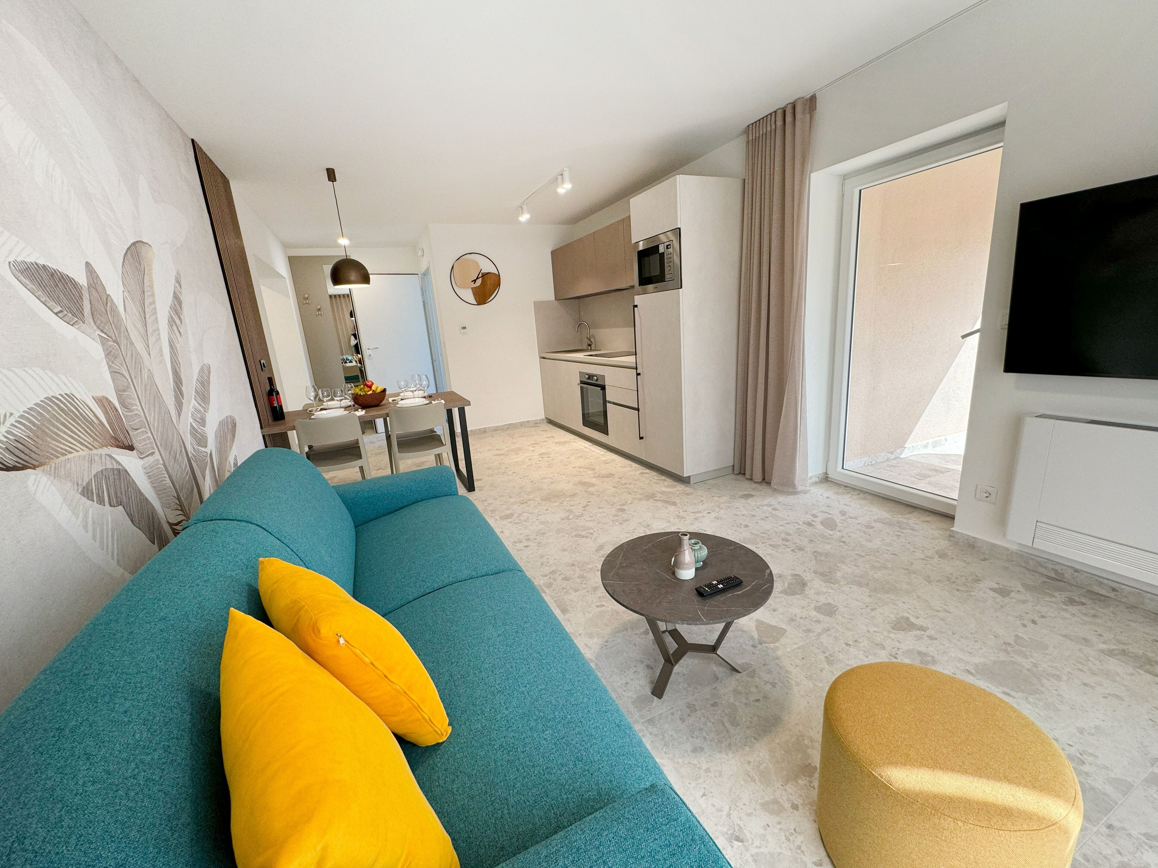 superior apartment, 1 bedroom, balcony, sea view | living area | 60-inch flat-screen tv with satellite channels, tv