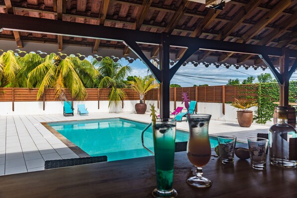 Outdoor pool, pool umbrellas, sun loungers