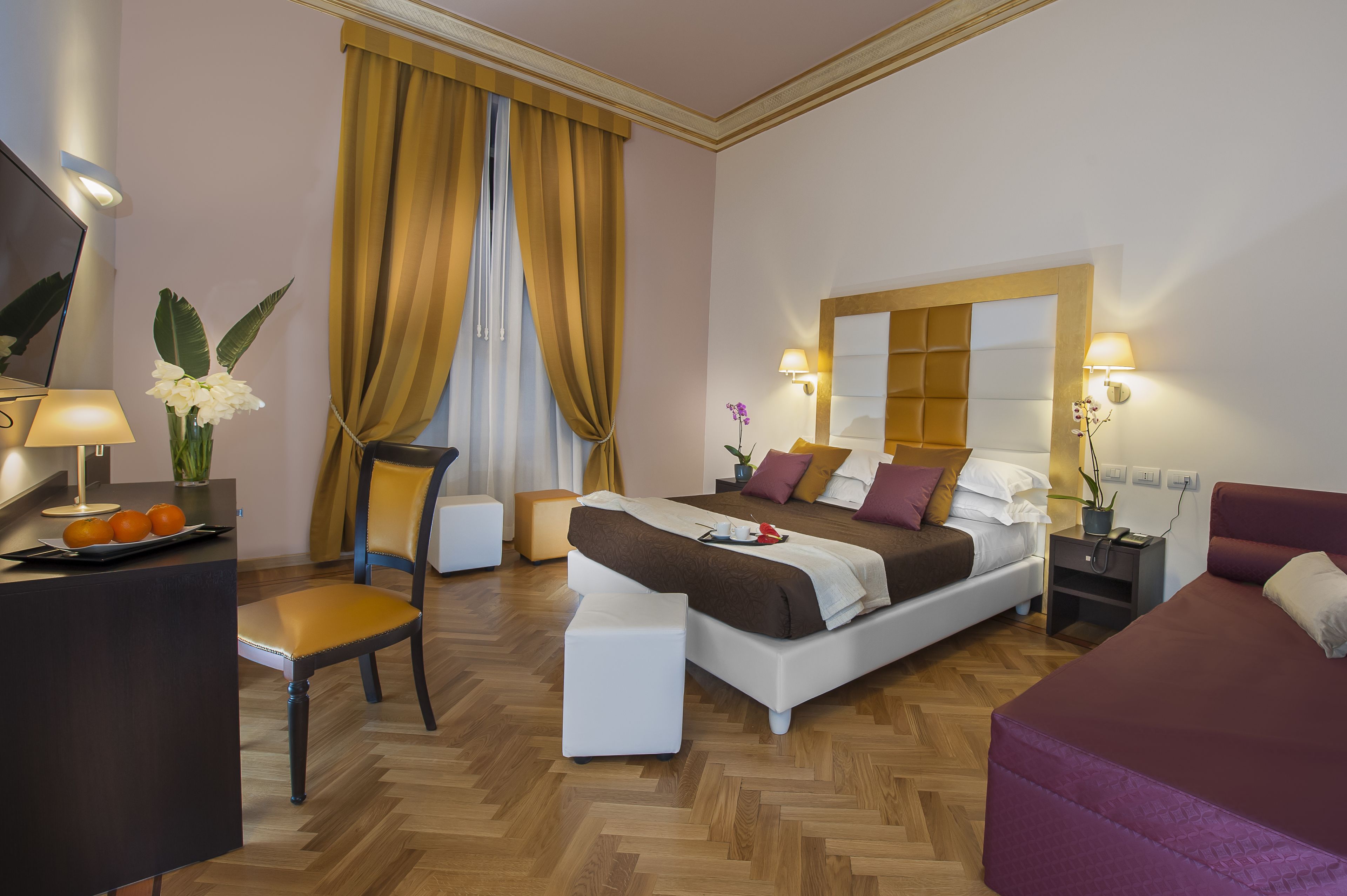 Deluxe Triple Room | Minibar, in-room safe, desk, laptop workspace