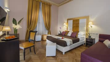 Deluxe Triple Room | Minibar, in-room safe, desk, laptop workspace