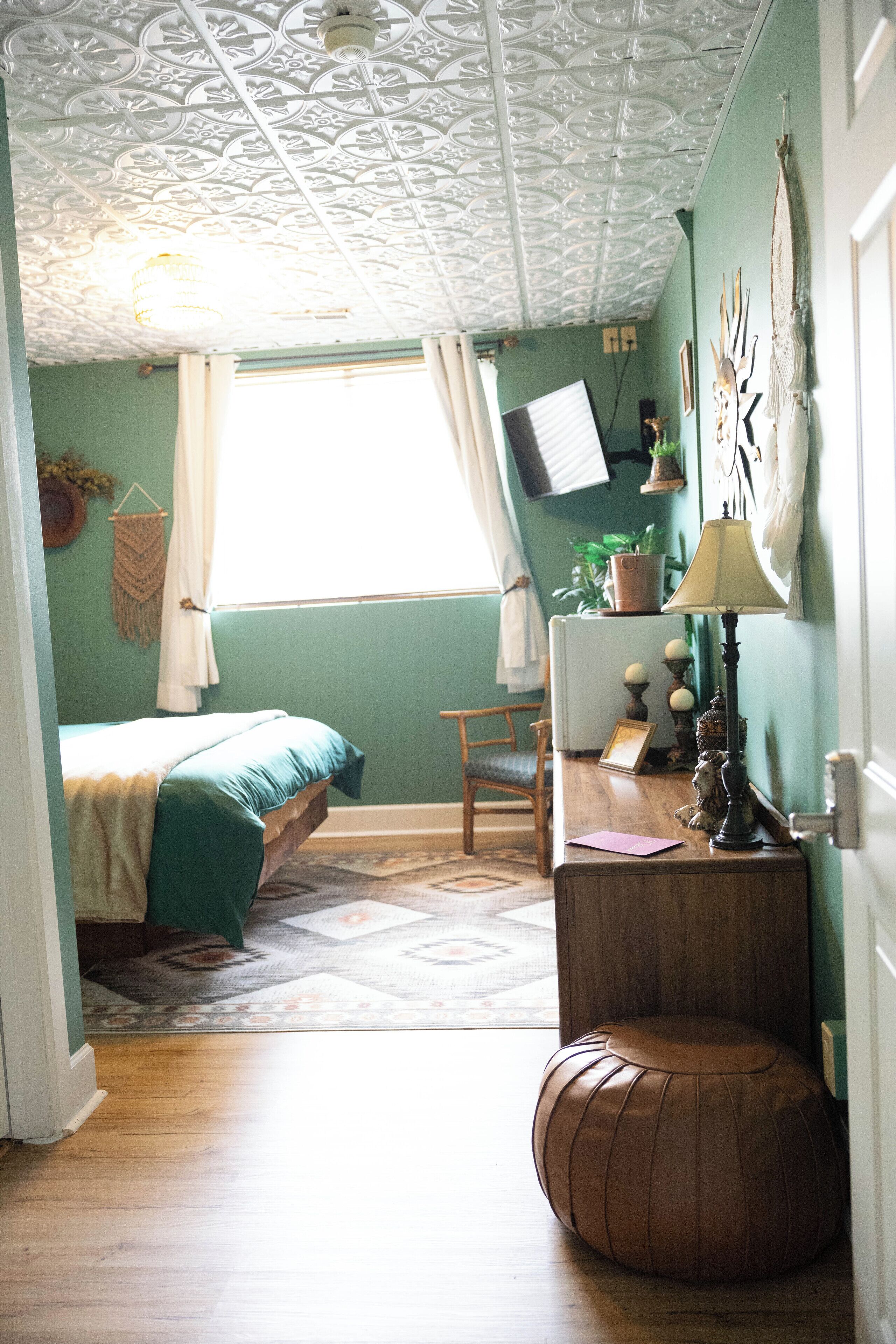 comfort room | premium bedding, desk, iron/ironing board, free cots/infant beds