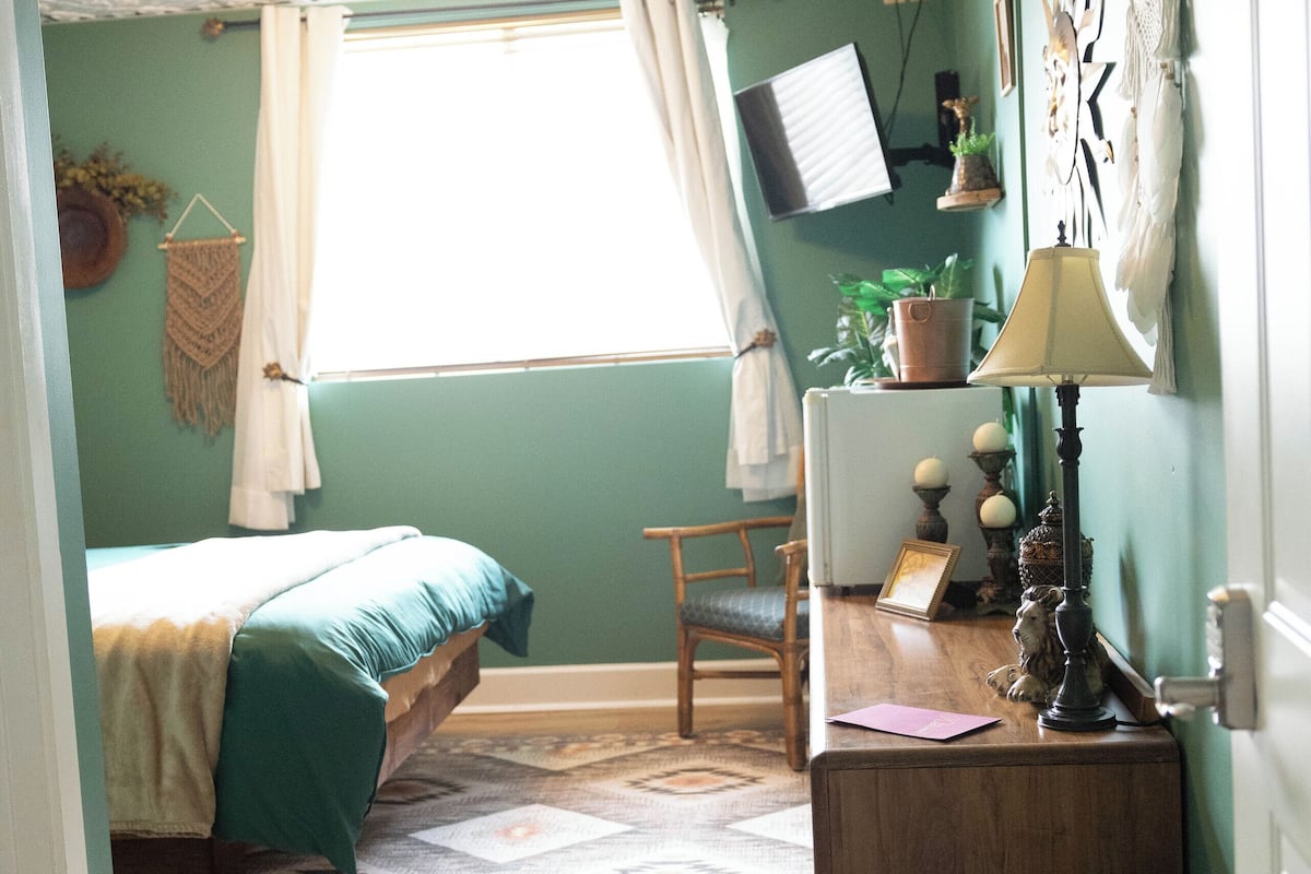 comfort room | premium bedding, desk, iron/ironing board, free cots/infant beds