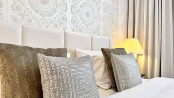 Egyptian cotton sheets, premium bedding, down duvets, memory-foam beds