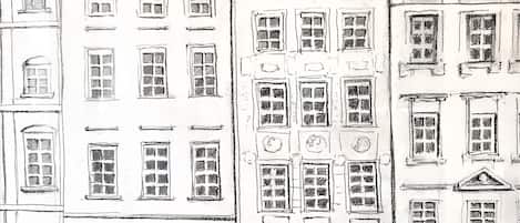 Boceto de una calle con edificios, incluyendo uno con el número '5' y una persona caminando.