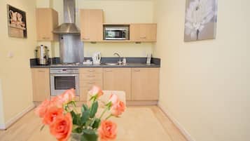 Fridge, microwave, stovetop, coffee/tea maker