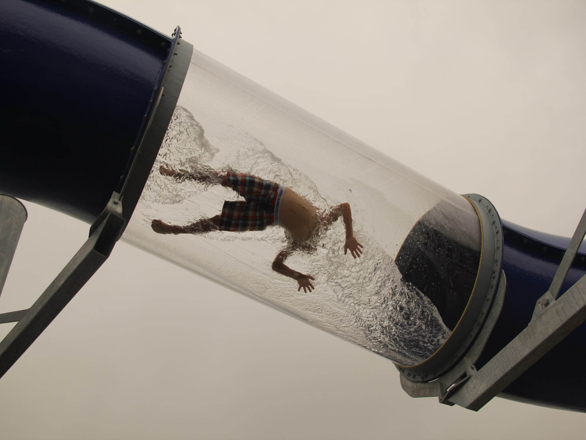 A water slide with a person sliding down.