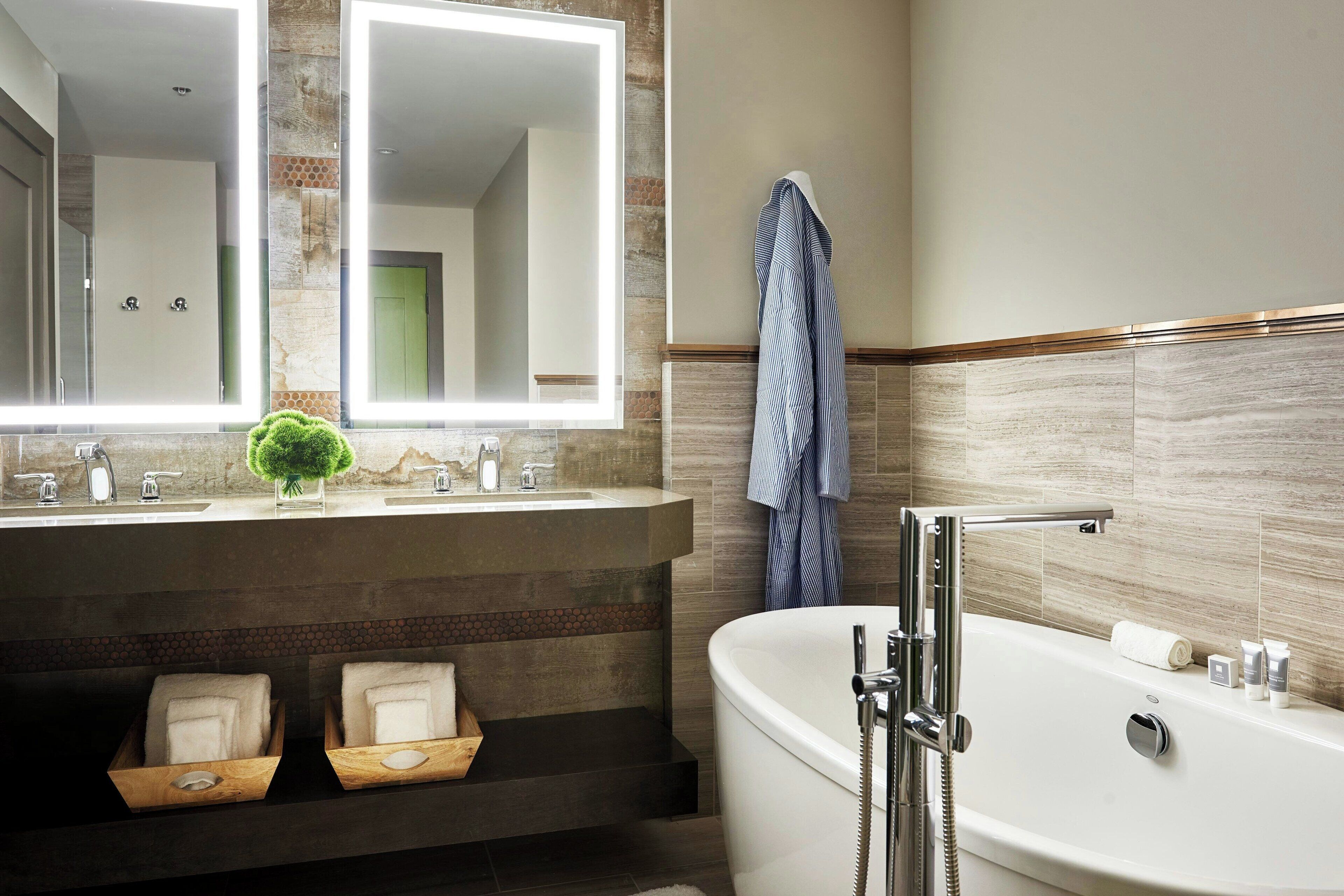 combined shower/bathtub, designer toiletries, hair dryer, bathrobes