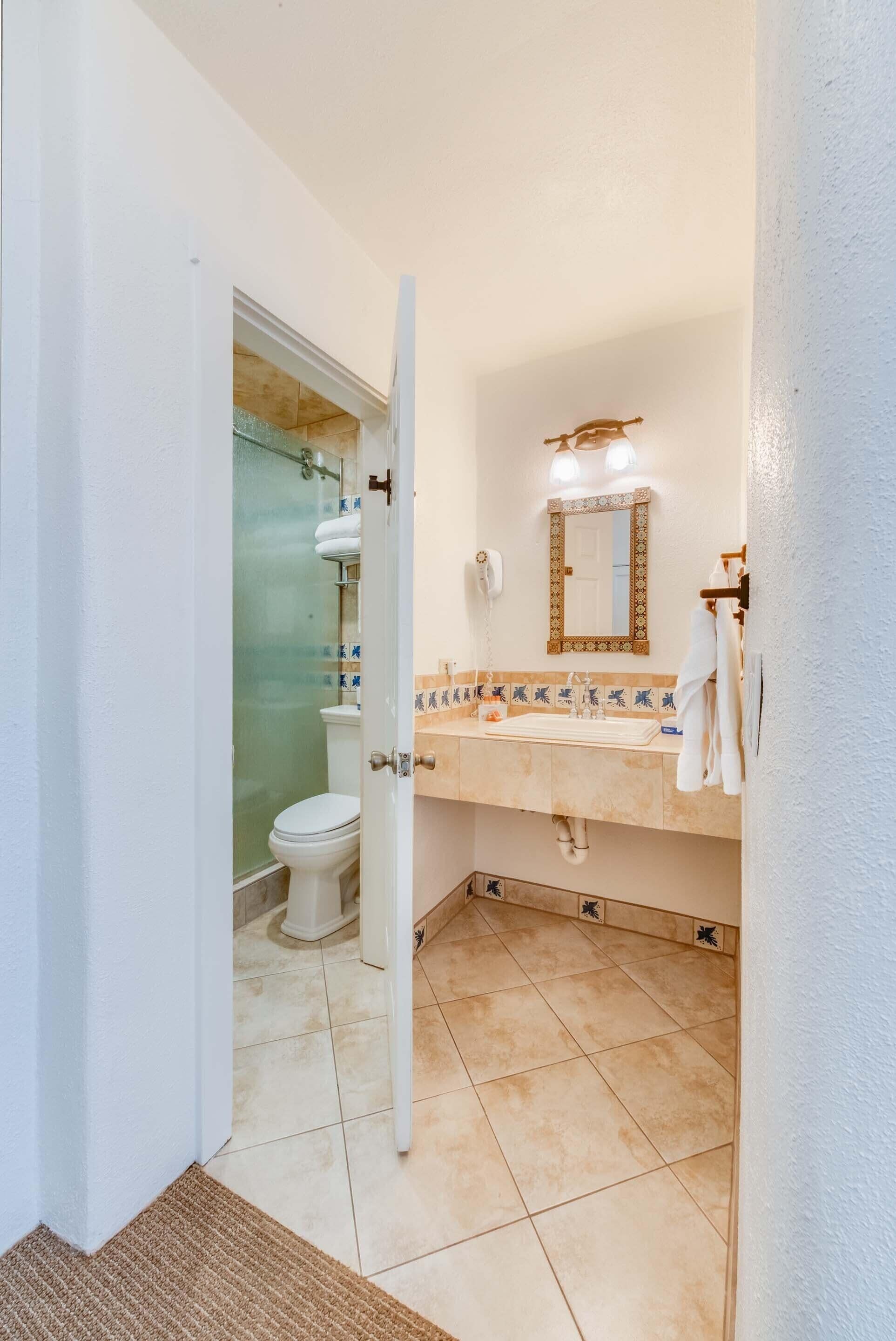Standard Two Queen | Bathroom | Free toiletries, towels