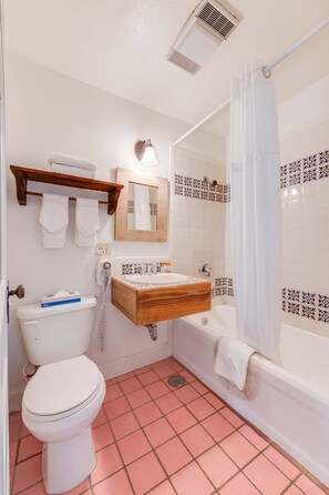 A bathroom with a toilet, sink, and bathtub. - The Historic Taos Inn (Taos)