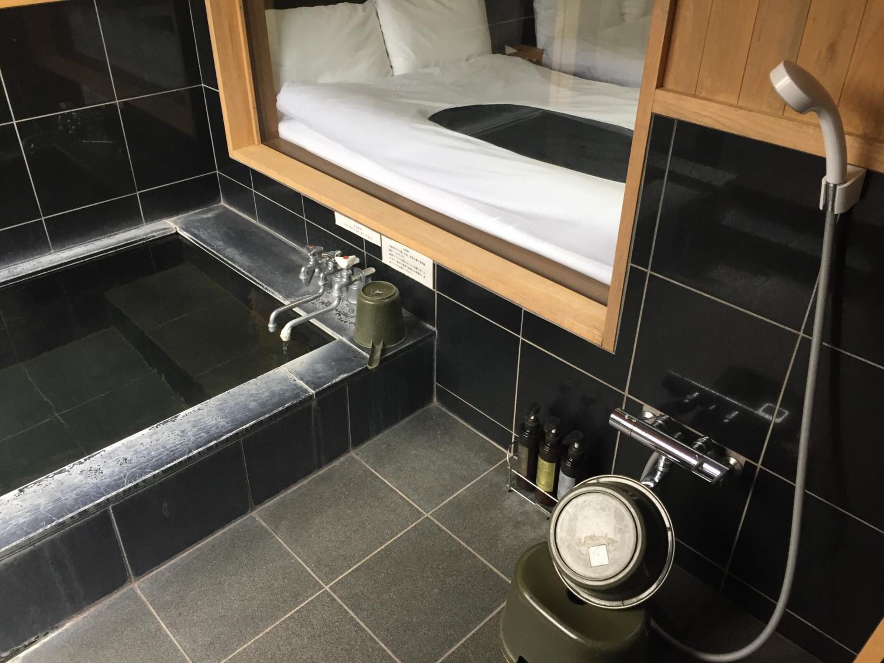 separate bathtub and shower, free toiletries, hair dryer, slippers