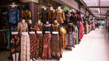 A clothing store with mannequins displaying various traditional garments.