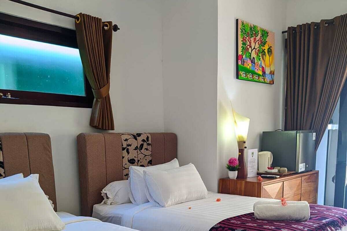 Habitación estándar con 1 cama matrimonial o 2 individuales | Edredón, minibar y caja de seguridad en la habitación 