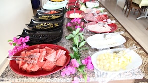 A buffet with various food items including watermelon, cheese, and other dishes. - Alin Hotel (Alanya)