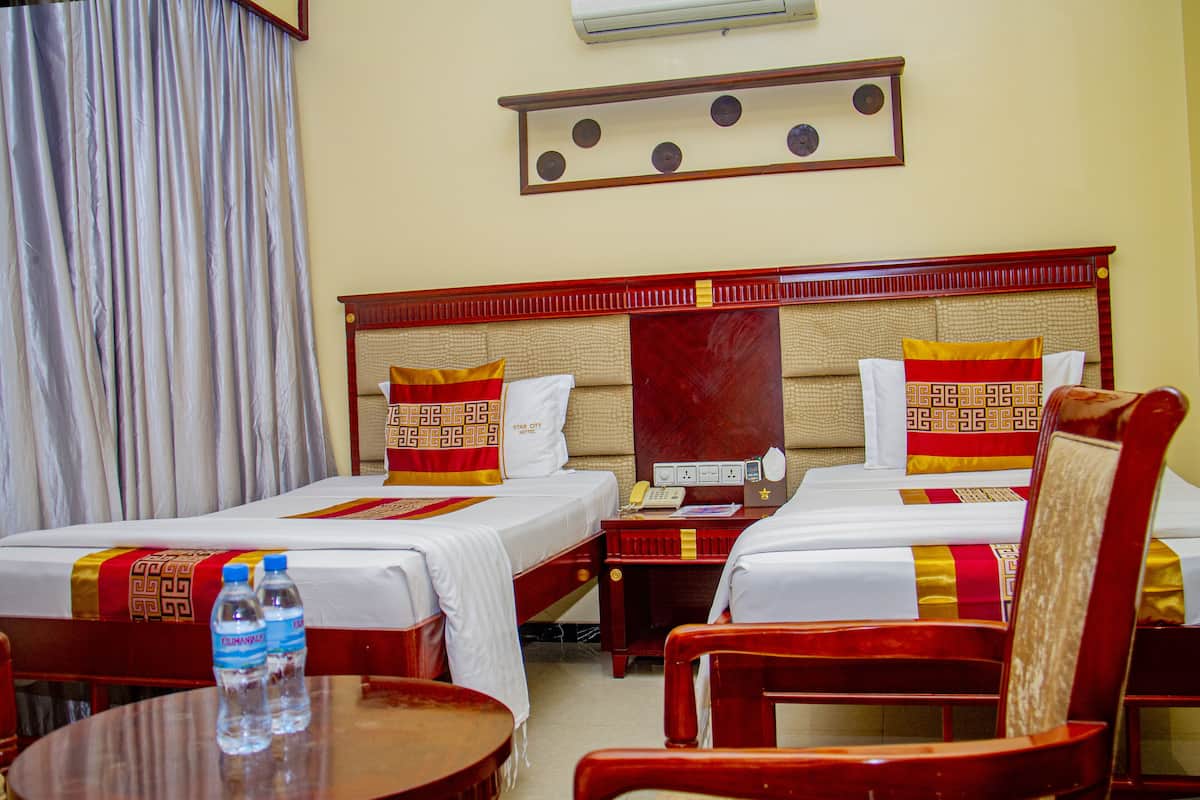 Standard Twin Room | Minibar, in-room safe, desk, blackout curtains