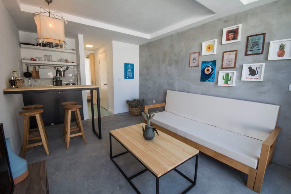 Familie studio suite, 1 slaapkamer, kitchenette, uitzicht op tuin | Woonruimte