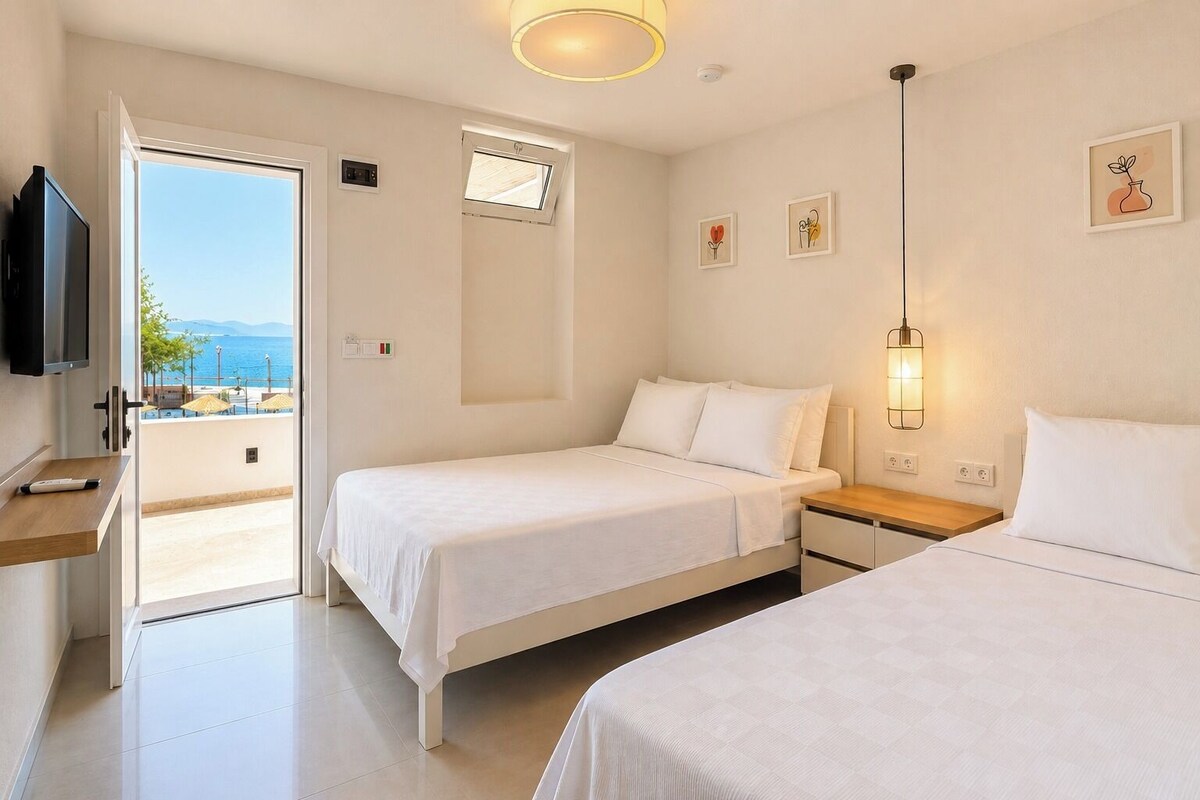 Habitació amb dos llits individuals estàndard, diversos llits, vistes al jardí, orientació mar | Roba de llit d'alta qualitat i cortines opaques 