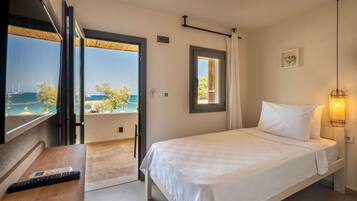 Habitación individual estándar, 1 cama individual, vista al jardín, frente al mar | Ropa de cama de alta calidad, cortinas blackout y wifi gratis