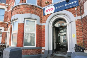 A building with a sign reading "OYO Queens Quarter" at the entrance. - OYO Queens Quarter (Belfast)