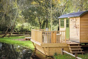 A wooden cabin with a deck and a small staircase leading to a door. - Lympstone Manor Hotel (Exmouth)